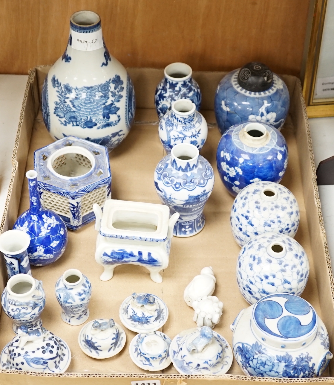 A collection of 18th - early 20th century Chinese blue and white porcelain vases, jars and spare covers, together with some Japanese blue and white ceramics, tallest 21cm